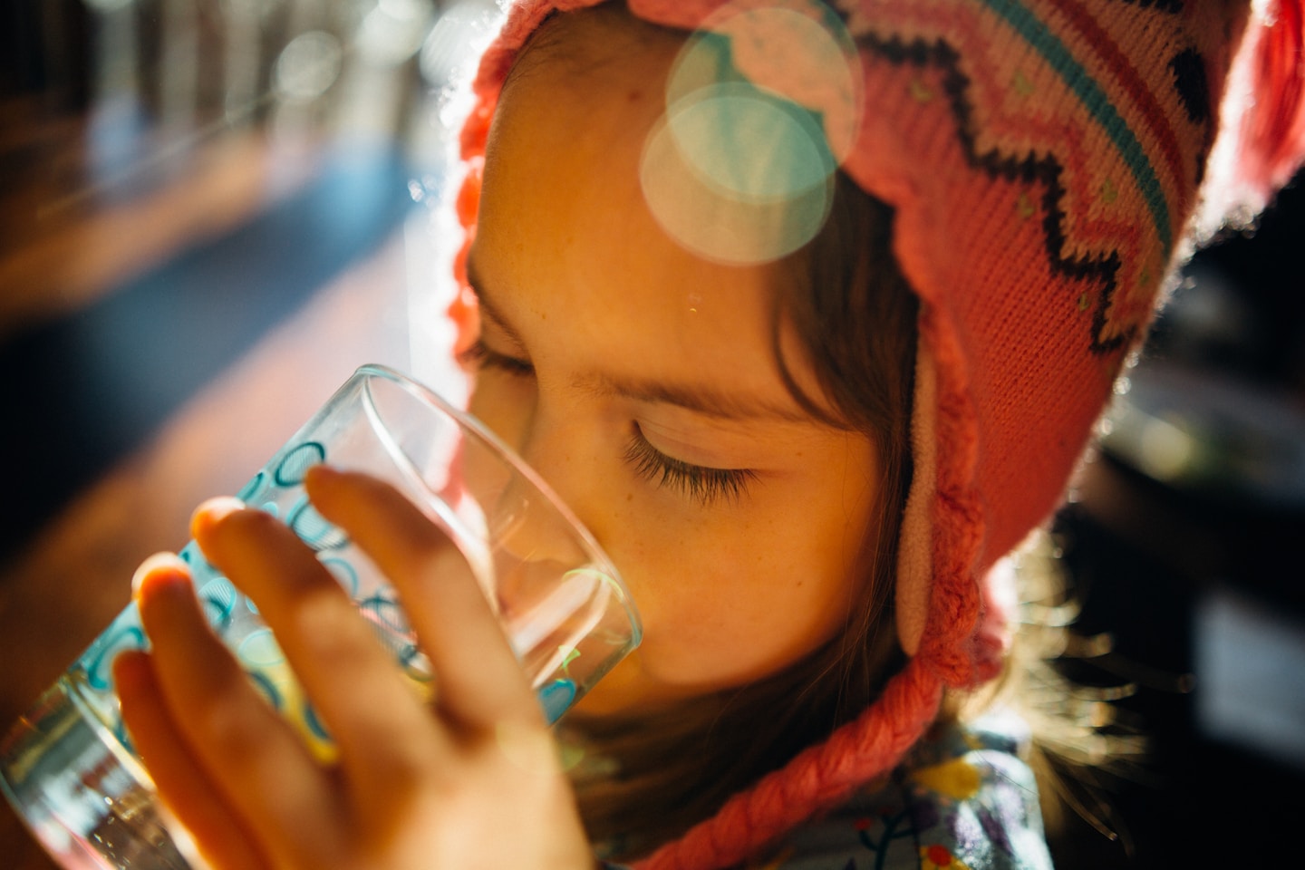 My youngest daughter drinking water at breakfast.